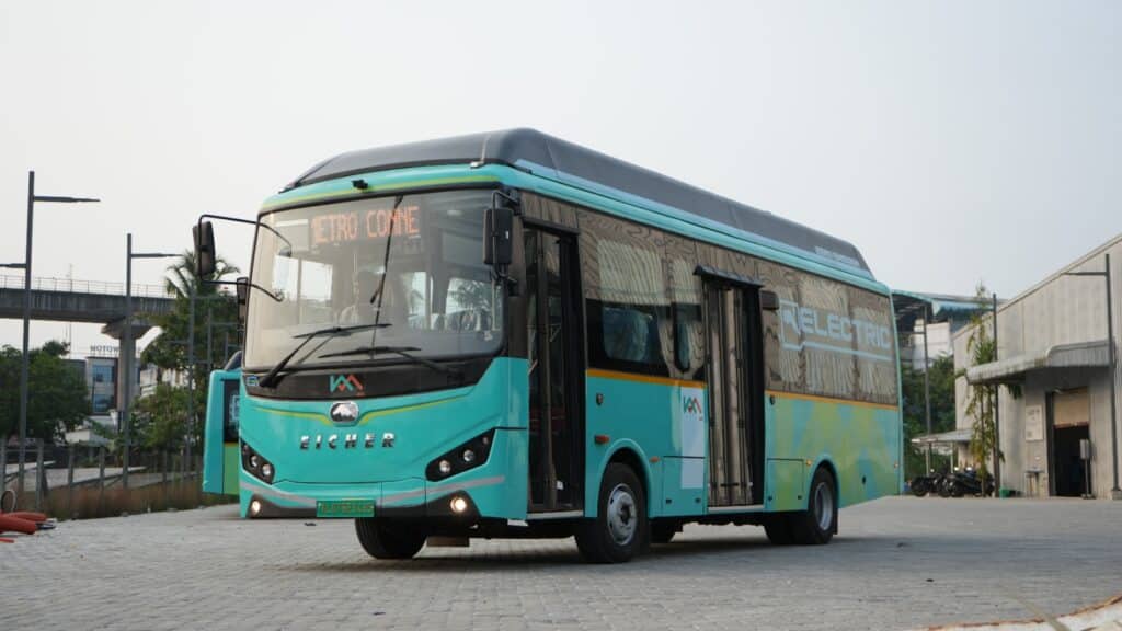Electric MetroConnect feeder bus in Kochi, parked near metro infrastructure and ready for service.